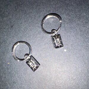 silver earrings with charm